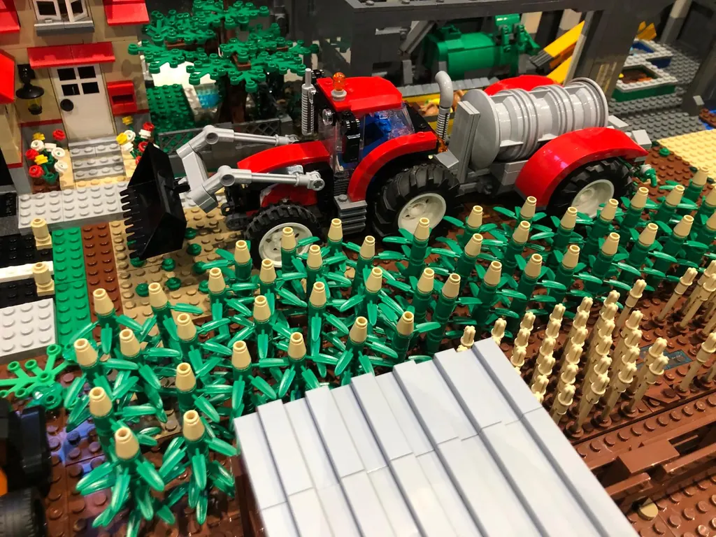 Technical brick model of an agricultural scene with machinery and crops