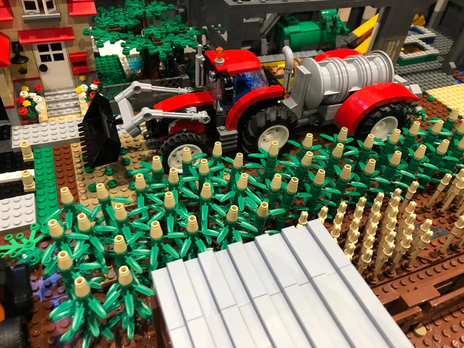 Brick farming scene: harvest, tractor and cultivated fields