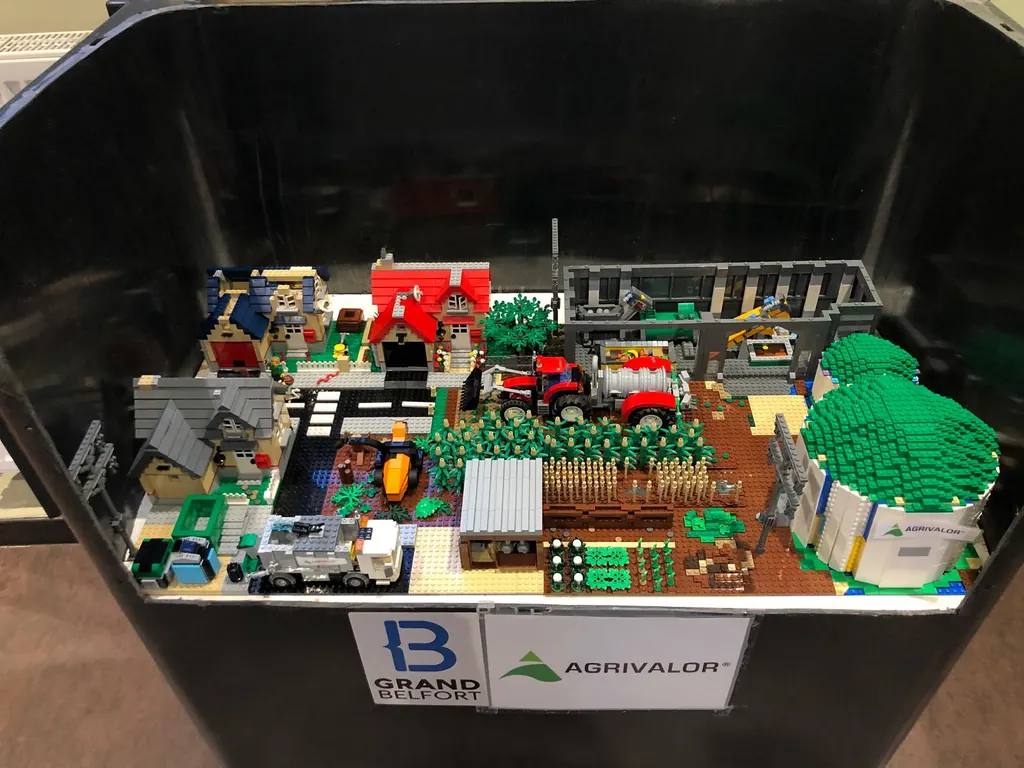Kitribrick model displayed in a case with Grand Belfort and Agrivalor branding